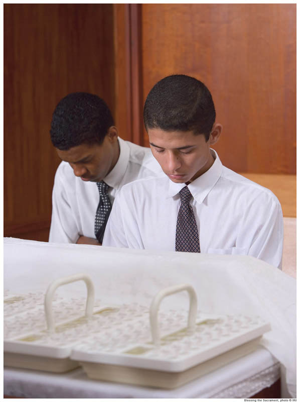 Mormon boys bless the Mormon sacrament (communion).