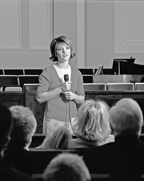 Mormon Woman speaking in Church
