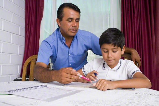 father and son studying at home