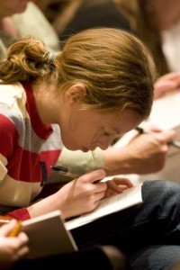 Girl taking notes in school