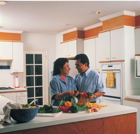 couple preparing salad together