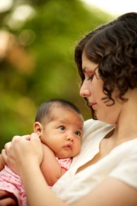 mother holding infant