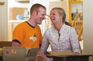 Couple unpacking together.