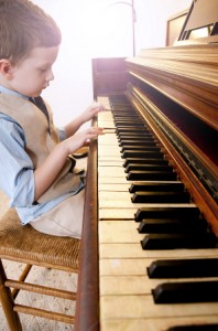 young boy playing piano