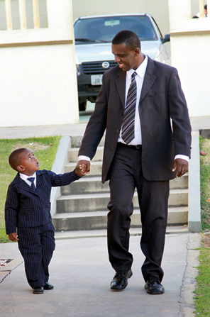 Father and son walking to General Conference