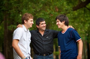 father talking with teen sons