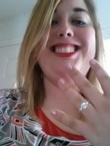 Ashley showing off a ring.