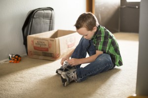 boy tying shoes