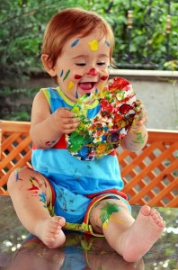 child getting paint on face