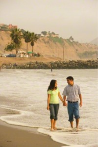 couple walking on beach.