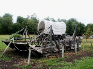 covered wagon sitting on raft at Nauvoo, Illinois