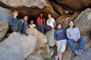 Teen girls sitting on rocks