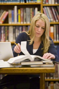 woman studying at library