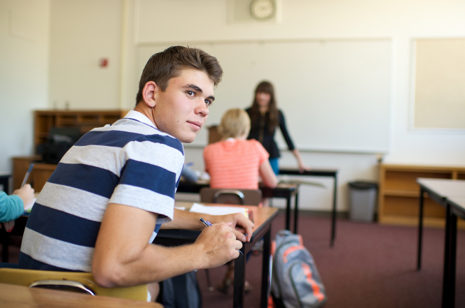 Teen boy in class