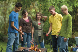 Mormon teens around campfire