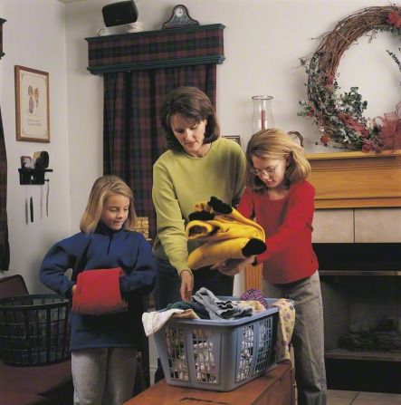 mother and daughters doing chores