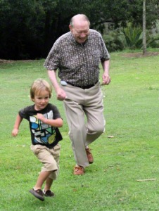grandfather and child running