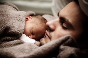 baby sleeping with father