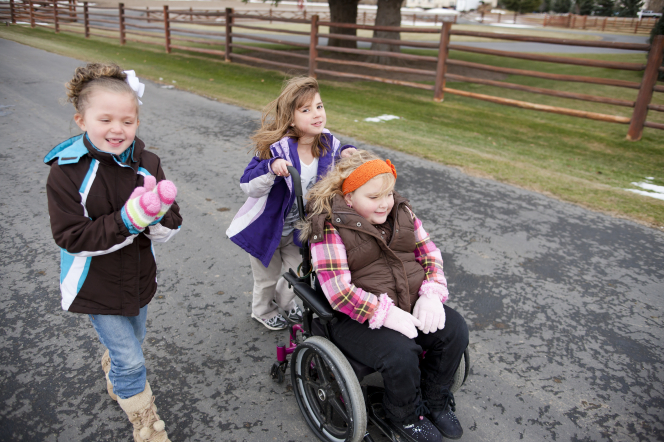 children with one child in a wheelchair