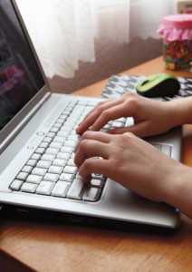 hands on a computer keyboard