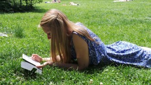 woman reading an ebook outside