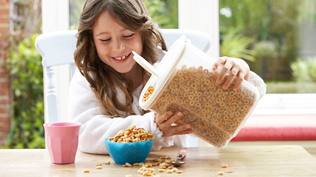 girl pouring cereal