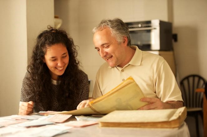 Father and daughter working on genealogy together