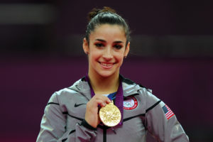 LONDON, ENGLAND - AUGUST 07: Gold medalist Alexandra Raisman of the United States poses on the podium during the medal ceremony for the Artistic Gymnastics Women's Floor Exercise final on Day 11 of the London 2012 Olympic Games at North Greenwich Arena on August 7, 2012 in London, England. (Photo by Michael Regan/Getty Images)