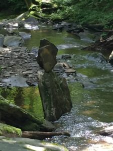 Impressive stack of stones in the river.
