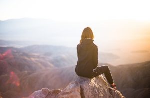 woman hiking mountain peak