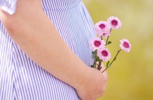pregnant woman flowers baby