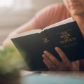 man reading book of mormon